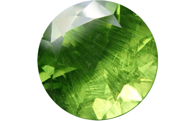 Demantoid Garnet Buyers Guide 1 - green colour - harse tails - round shape - faceted - russia Demantoid Garnet Buyer’s Guide – Properties, Treatments & Value Demantoid Garnet Buyers Guide 1 - green colour - harse tails - round shape - faceted - russia